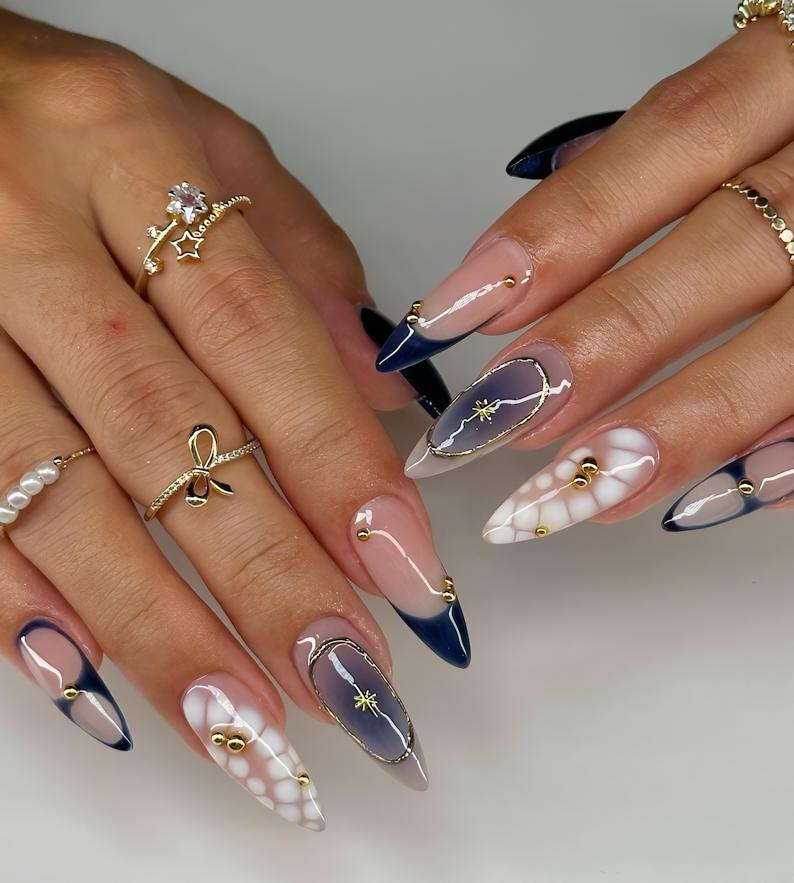 Stylish Almond Nails with Gold Accents - Trendy Manicure