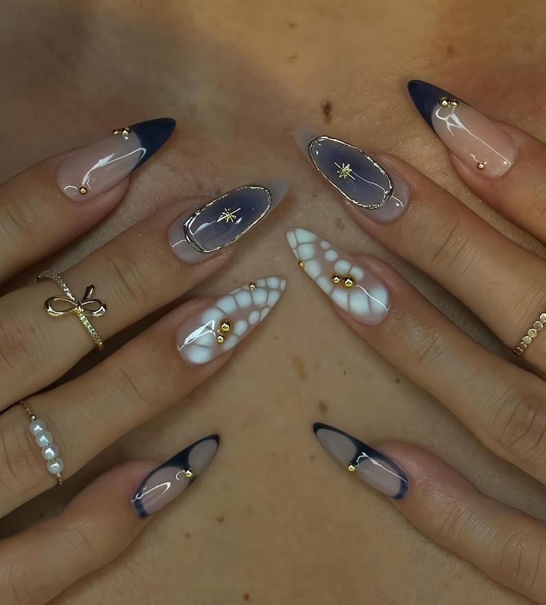 Stylish Almond Nails with Gold Accents - Trendy Manicure