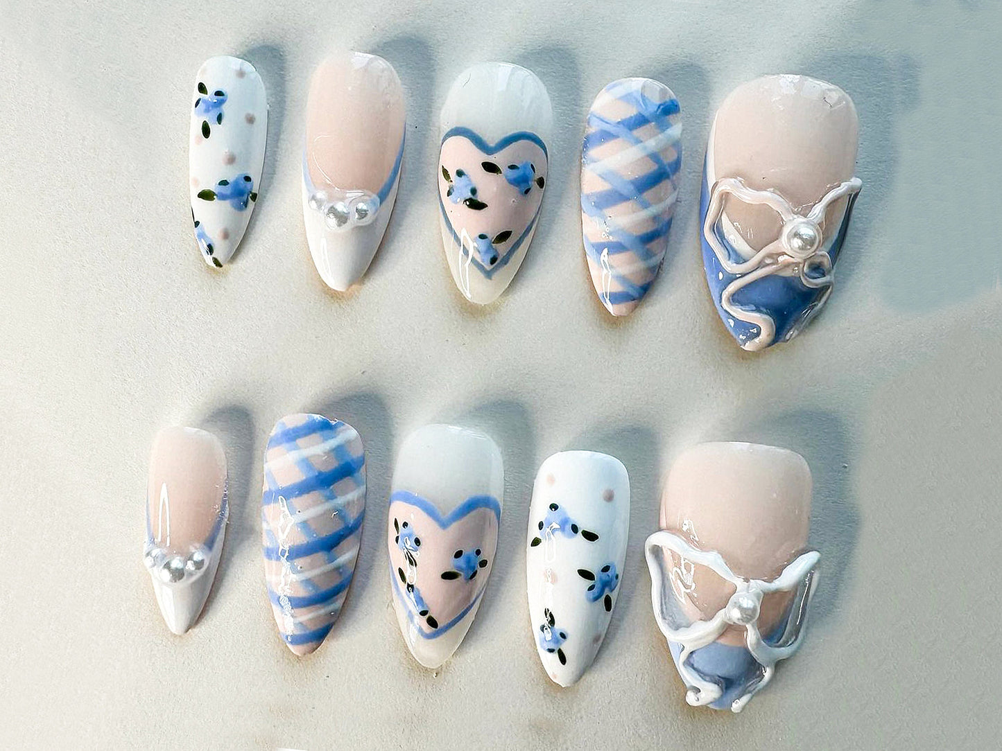 Dreamy Coquette Style Nails with Hearts and Pearls.
