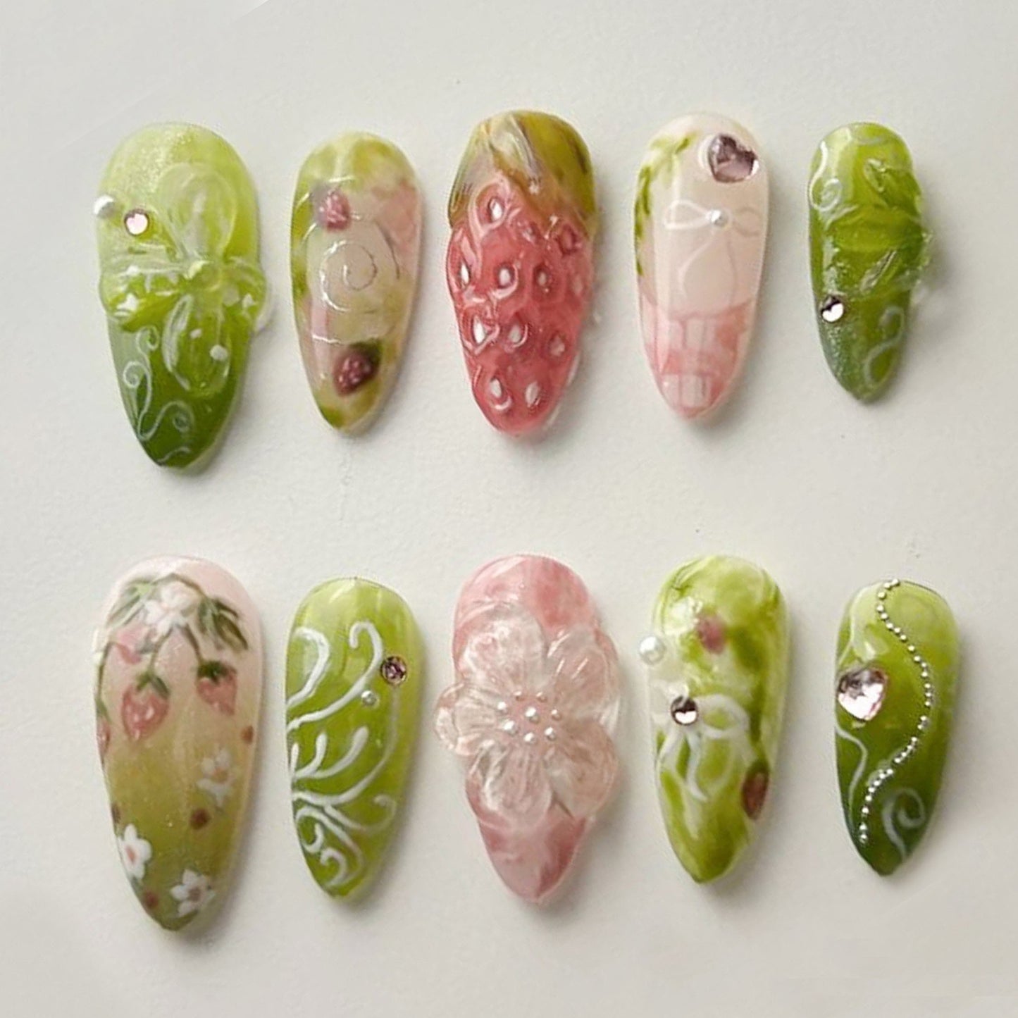 Dreamy Strawberry Garden Nails with Floral Charm.
