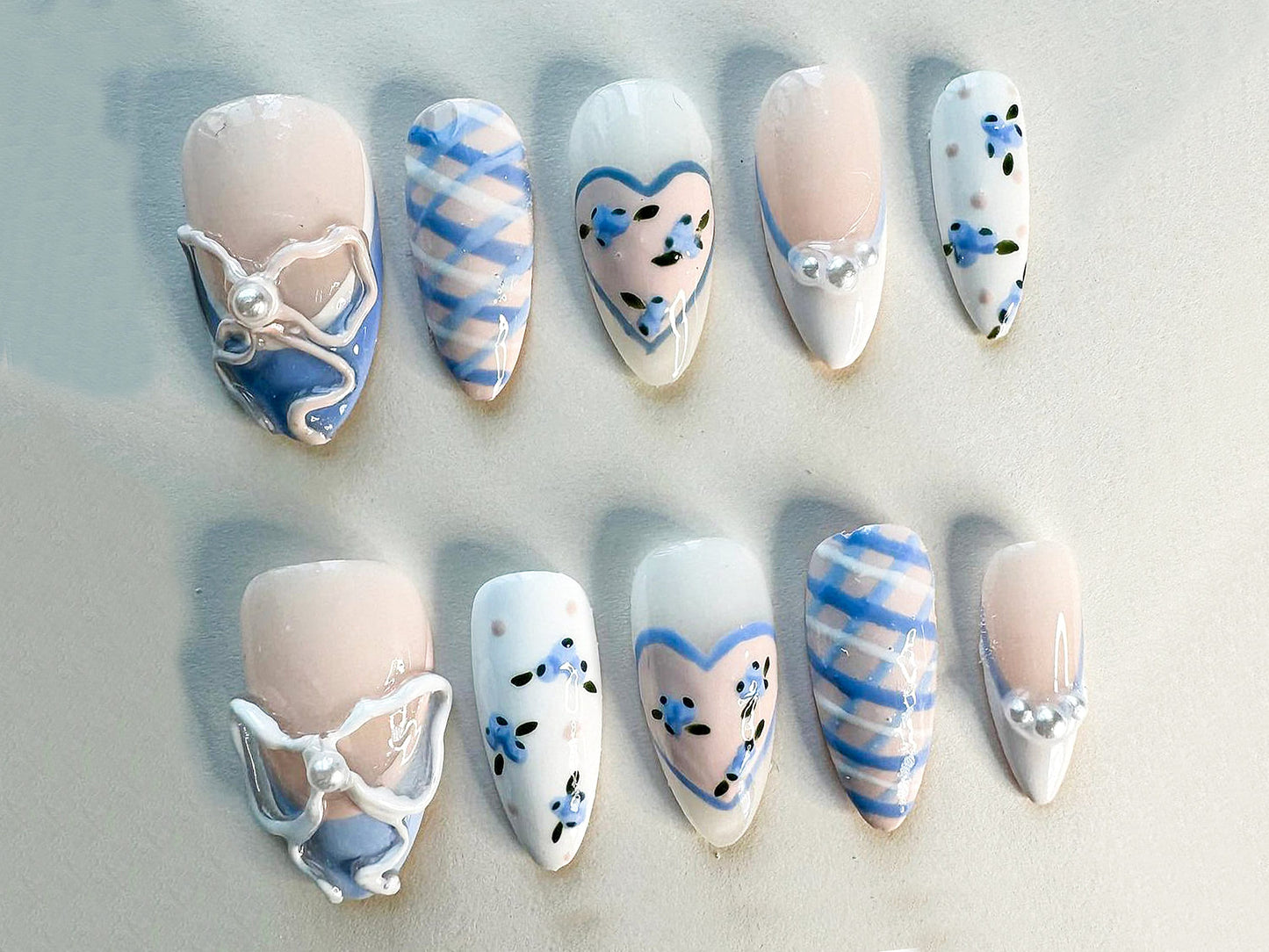 Dreamy Coquette Style Nails with Hearts and Pearls.