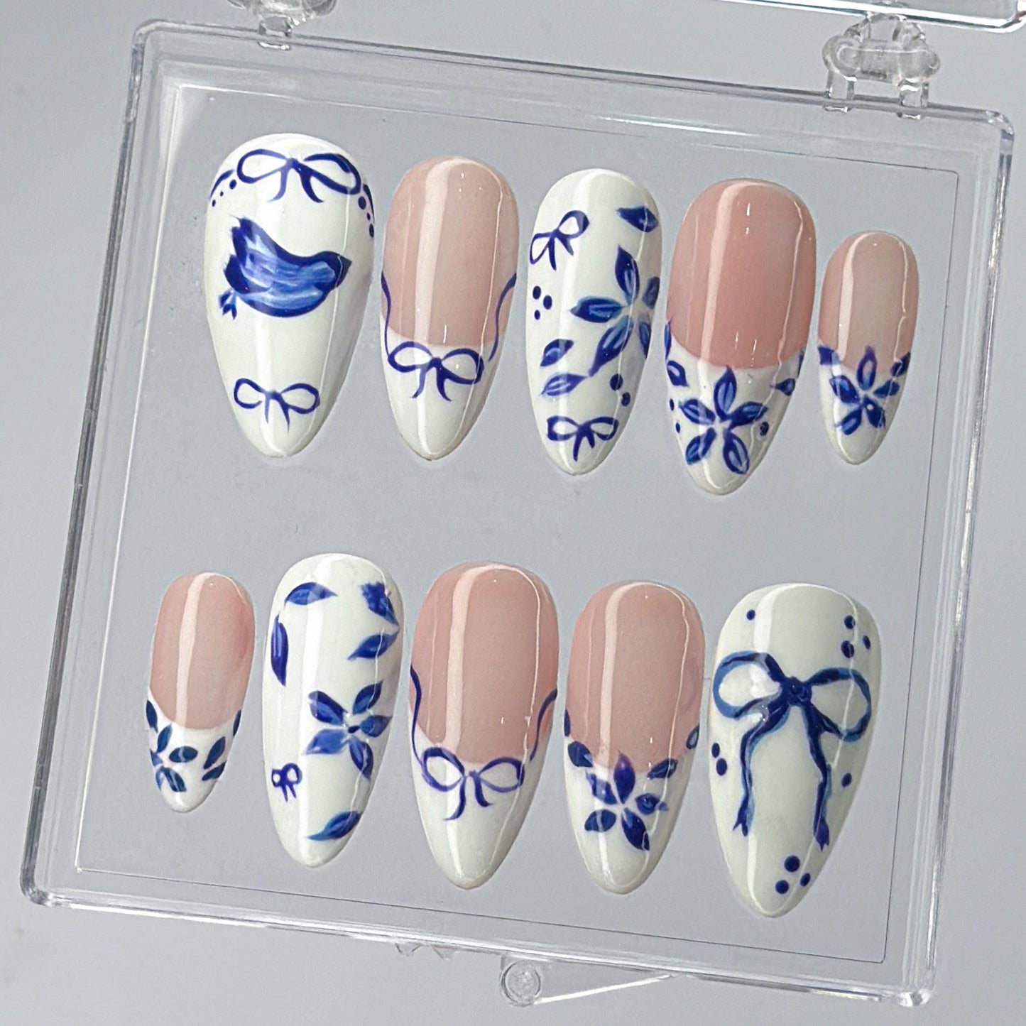Blue Ceramic Press-On Nails with Artistic Charm.