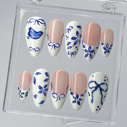 Blue Ceramic Press-On Nails with Artistic Charm.