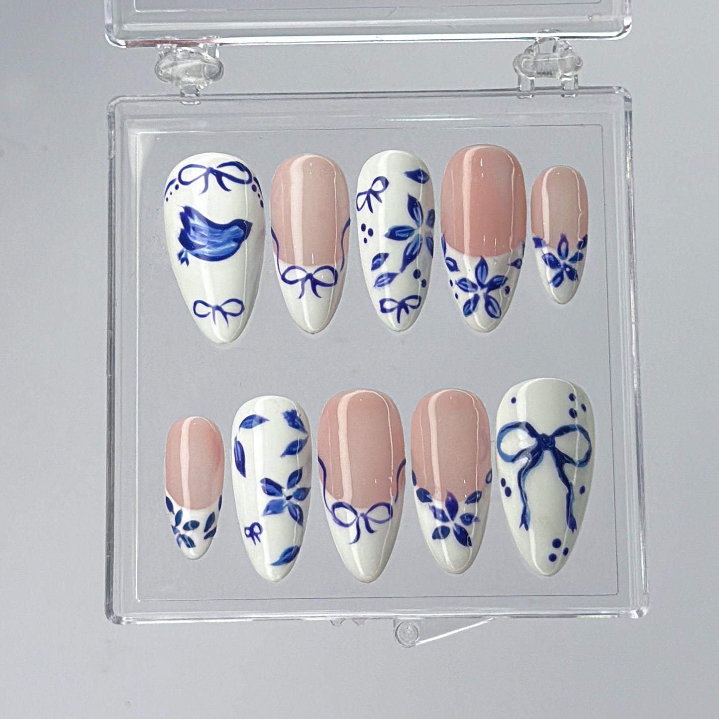 Blue Ceramic Press-On Nails with Artistic Charm.
