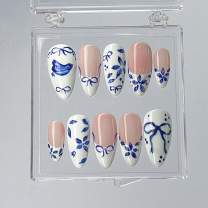 Blue Ceramic Press-On Nails with Artistic Charm.
