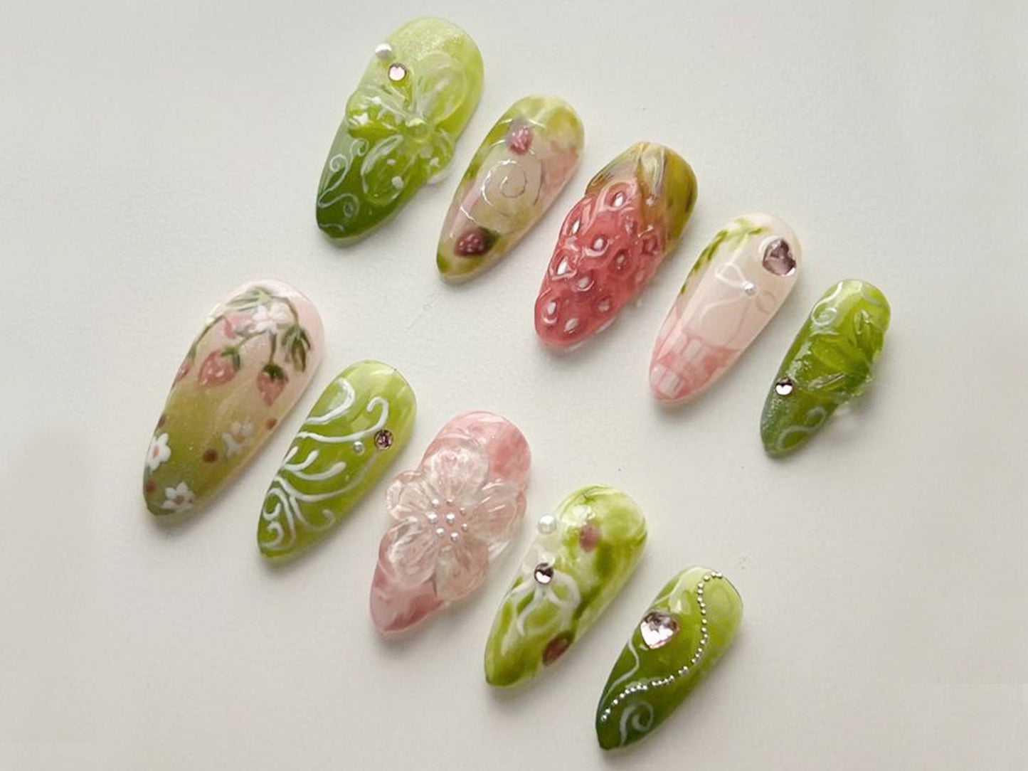 Dreamy Strawberry Garden Nails with Floral Charm.