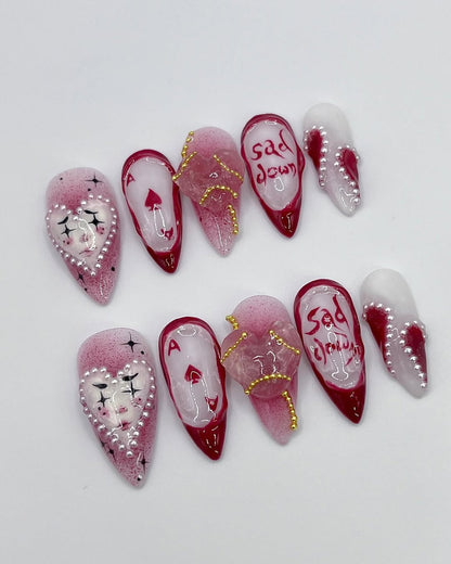 Handmade Red and White Press-On Nails with Artistic Heart Design