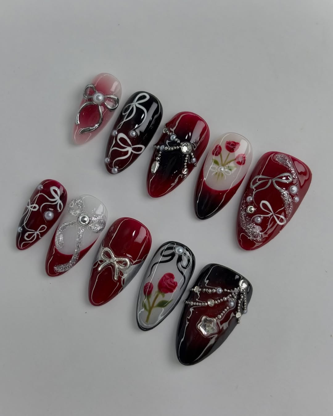 Deep Red Rose Nails with Silver Ribbon and Pearl Detailing Handmade Luxury Design