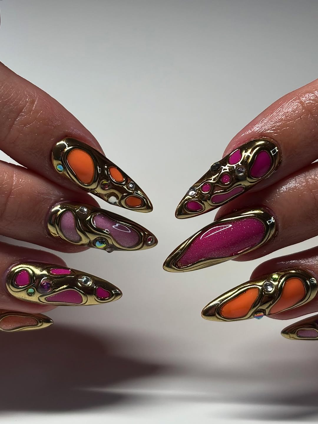 Molten Metal Abstract Press On Nails with Gold Frame, Neon Pink & Orange Glow
