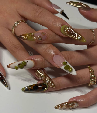 Olive Gold Abstract Sculpted Stiletto Nails with Glossy Pearl and Tortoise Details