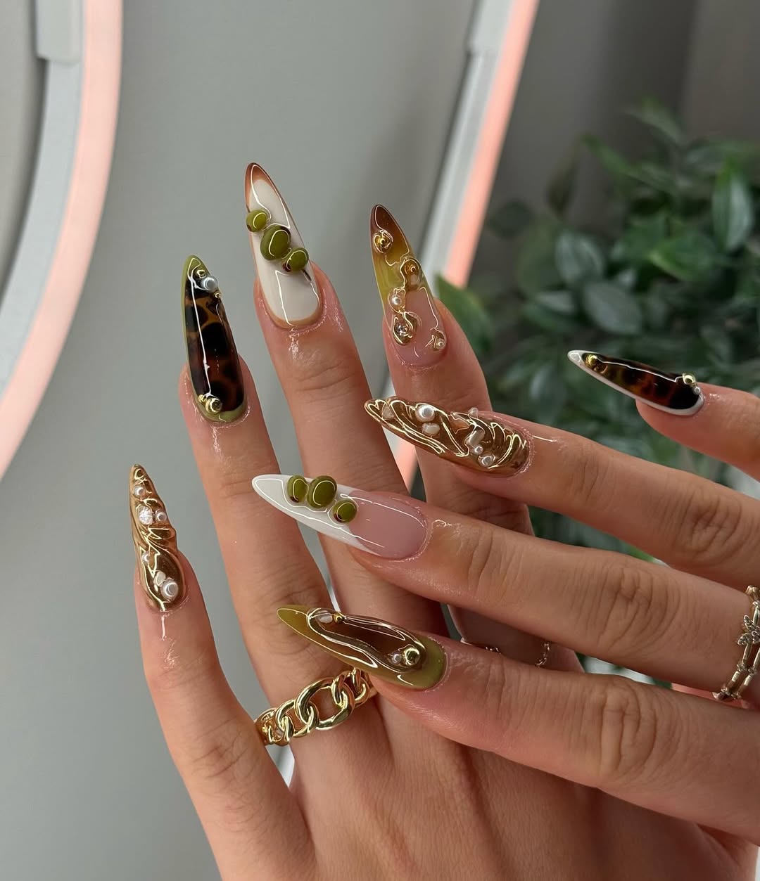 Olive Gold Abstract Sculpted Stiletto Nails with Glossy Pearl and Tortoise Details