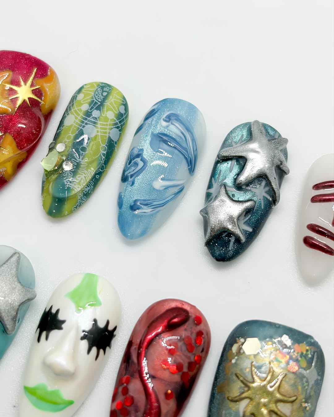 Cosmic Art Press On Nails with Metallic Stars, Face Design, and Galaxy Texture