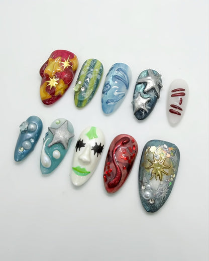 Cosmic Art Press On Nails with Metallic Stars, Face Design, and Galaxy Texture