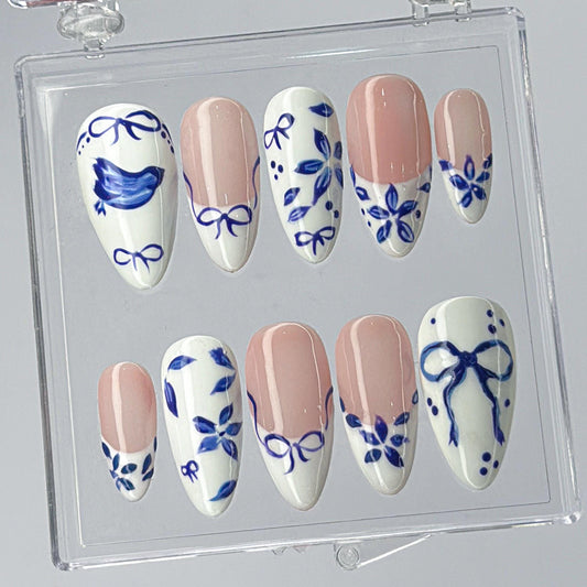 Blue Ceramic Press-On Nails with Artistic Charm.