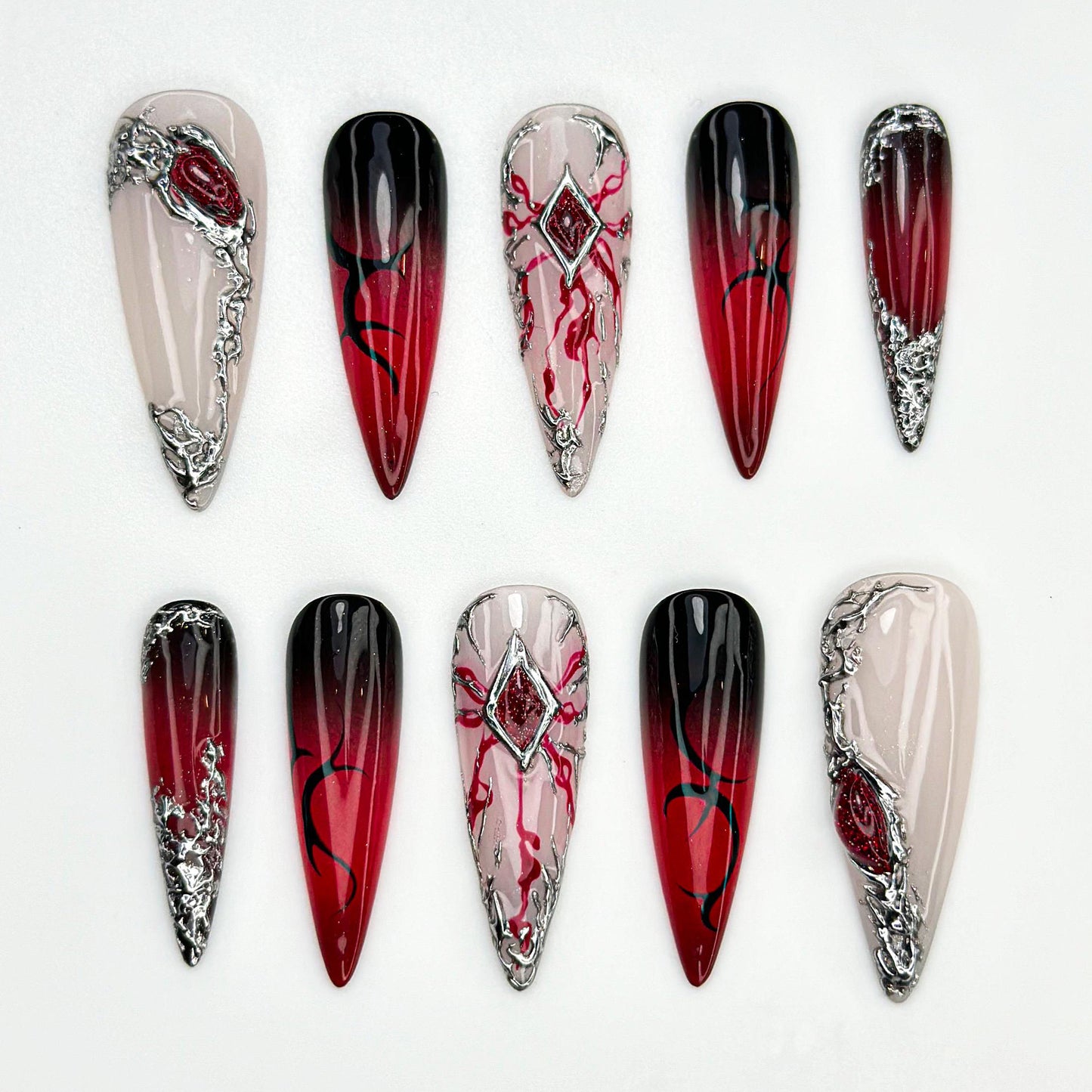Stunning Red Ombre Stiletto Nails with Silver Accents