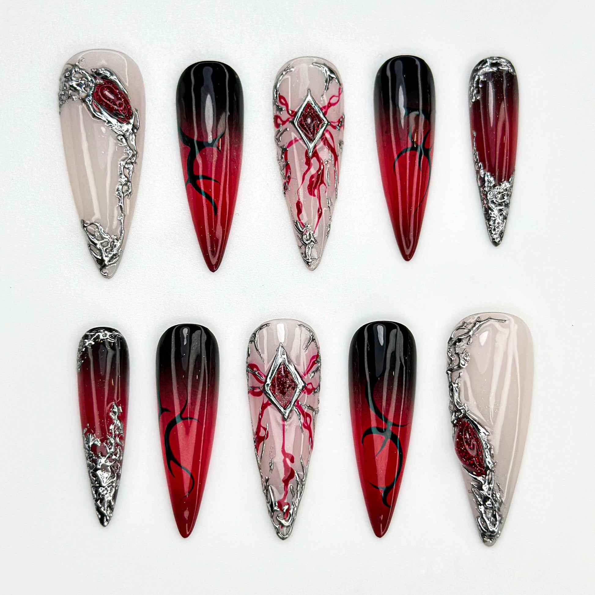 Stunning Red Ombre Stiletto Nails with Silver Accents