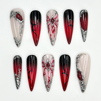 Stunning Red Ombre Stiletto Nails with Silver Accents