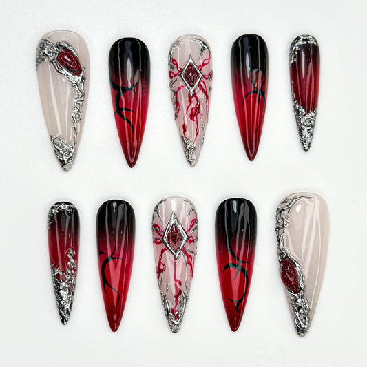 Stunning Red Ombre Stiletto Nails with Silver Accents